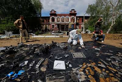 Image for Forensic experts sift through ruined dormitory in Russian-held Luhansk region