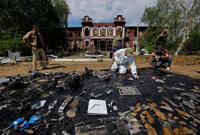 Image for Forensic experts sift through ruined dormitory in Russian-held Luhansk region