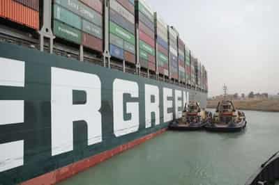 Image for Ship blocking Suez Canal like &#8216;beached whale&#8217; could be stuck for weeks