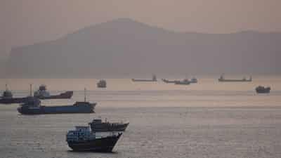 Image for Trump says US to help ships stranded in Strait of Hormuz as tanker hit by projectiles