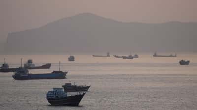 Image for Trump says US to help ships stranded in Strait of Hormuz as tanker hit by projectiles