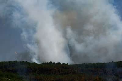 Image for Wildfire threat moving east, threatening Italy and Greece, EU says