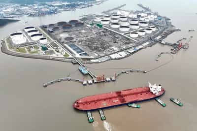 Image for Oil prices up 1% to 4-week high on big US crude withdrawal, China stimulus