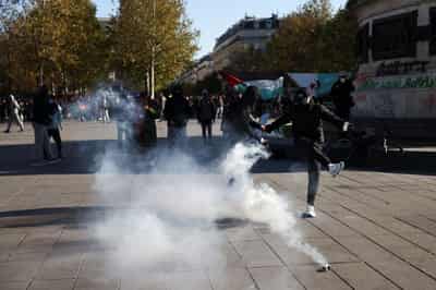 Image for French markets tumble as riots add to political crisis 