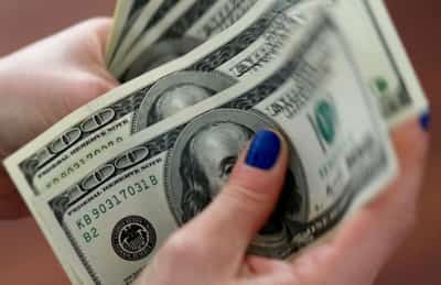 Image for US dollar retreats as prospect of Fed rate cuts overshadows growth data