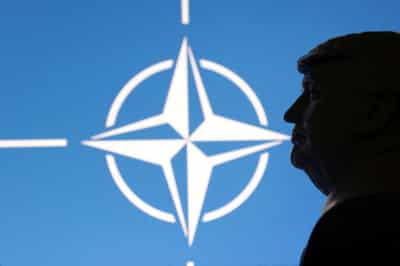 Image for US to cut roughly 200 NATO positions, sources say