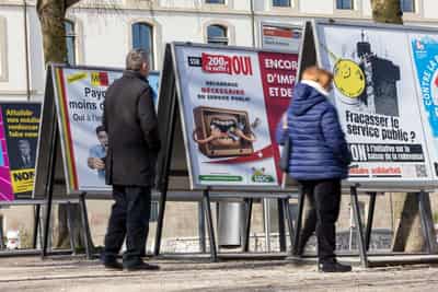 Image for Swiss voters set to reject plan to cut funding for state broadcaster
