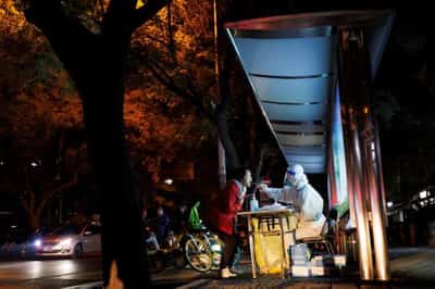 Image for New China COVID rules spur concern as some cities halt routine tests