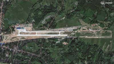 Image for Exclusive-Attack aircraft, military vehicles visible at new China-Laos base, satellite images show
