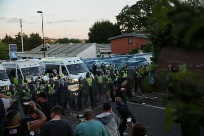 Image for UK interior minister condemns violent reaction to handcuffed student's murder