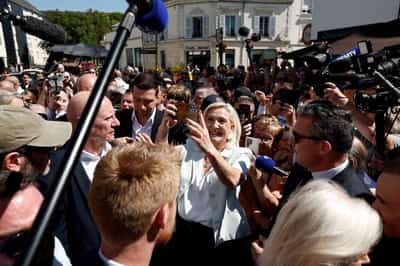 Image for Cheers and boos for Le Pen's French campaign launch after guilty verdict
