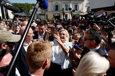 Image for Cheers and boos for Le Pen's French campaign launch after guilty verdict