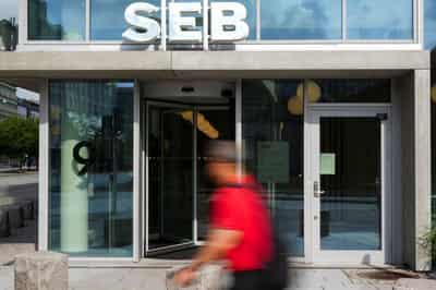 Image for Swedish bank SEB Q3 net profit below forecast, pauses share buybacks