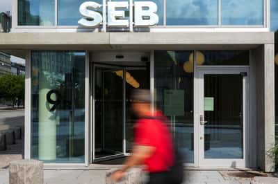 Image for Swedish bank SEB Q3 net profit below forecast, pauses share buybacks