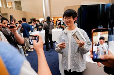 Image for Apple fans, customers react as iPhone Duo hits stores