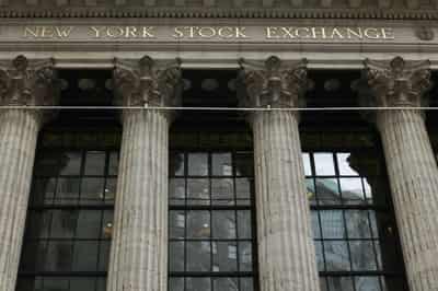 Image for Wall Streets sinks, bond yields up as Powell suggests aggressive Fed policy