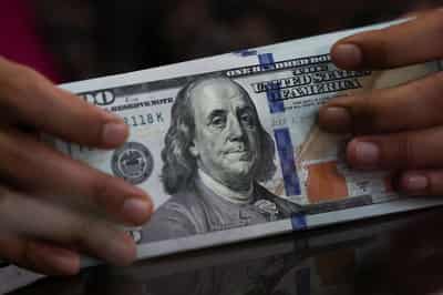 Image for Dollar rebounds from losses sparked by Treasury buyback plan