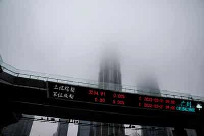 Image for Stocks surge in Asia as US averts default, Fed pause bets rise