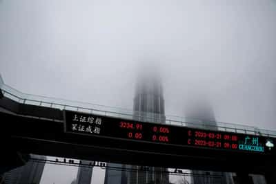 Image for Stocks surge in Asia as US averts default, Fed pause bets rise