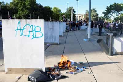 Image for Swiss police fire tear gas as anti-G7 protesters target UN site