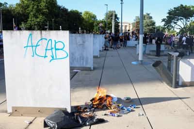 Image for Swiss police fire tear gas as anti-G7 protesters target UN site