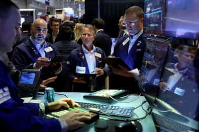 Image for Stocks rise, U.S. yields slip as markets await Fed rate hike