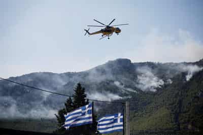 Image for Greek crews fight wildfire northwest of Athens for fourth day