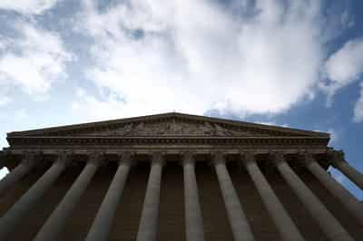 Image for French lawmakers adopt tax hikes on global firms amid volatile budget talks