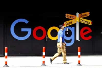 Image for Alphabet sets profit record, plans $50 billion buyback