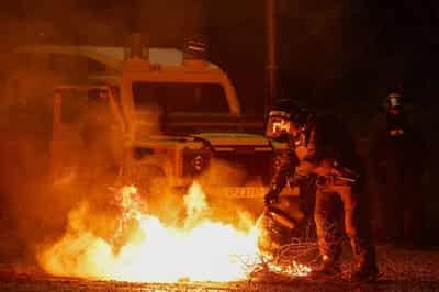Image for Police attacked as Northern Irish violence spreads to another town