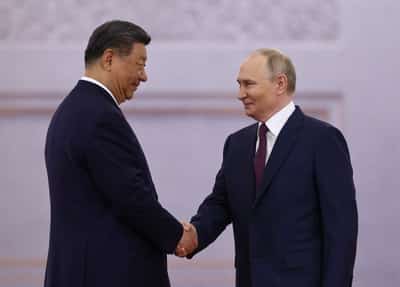 Image for 'Friends of steel': Xi and Putin pledge to stand together against US