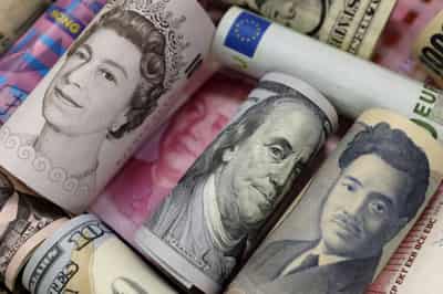 Image for Dollar slips, yuan steadies after central bank moves to limit gains