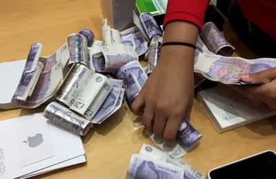 Image for Sterling holds near two-month highs in volatile week
