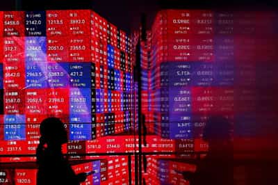 Image for Stocks hit fresh record, dollar weakens to lowest in three years amid Fed worries