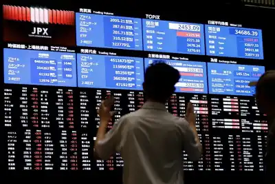 Image for Asian stocks slide after Fed flags slower rate cuts, BOJ stands pat