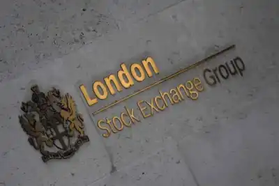 Image for Commodity-linked stocks push FTSE 100 higher; retailers slide