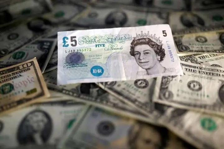 Image for Dollar sinks, sterling jumps as market turns to risk assets