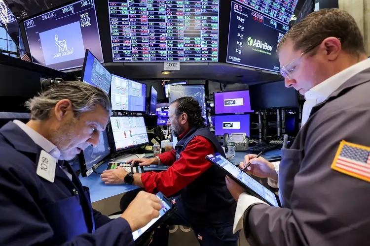 Image for Global stocks drop as Fed signals slower pace of rate cuts