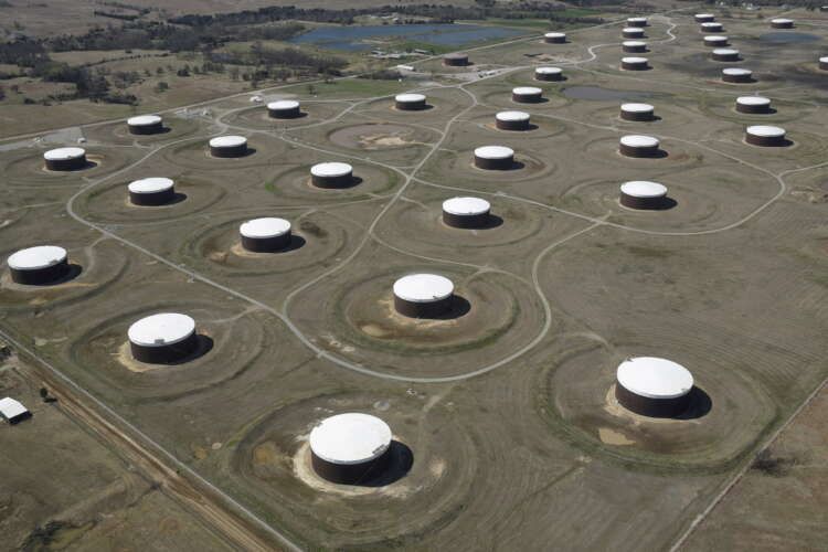Image for Oil settles up after hitting 15-month highs on demand prospects