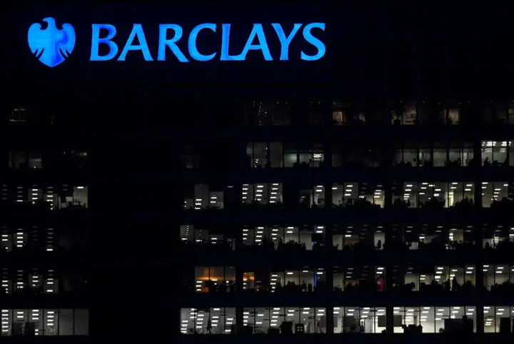 Image for Barclays resumes dividend as annual profit halves