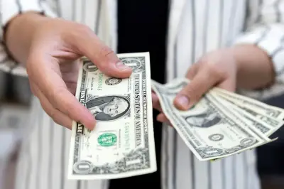 Image for Dollar edges lower in choppy trading after Fed rate cut