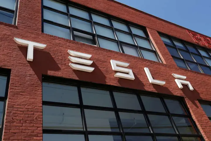 Image for Tesla edges past Wall Street target as bitcoin sales, environmental credits boost revenue