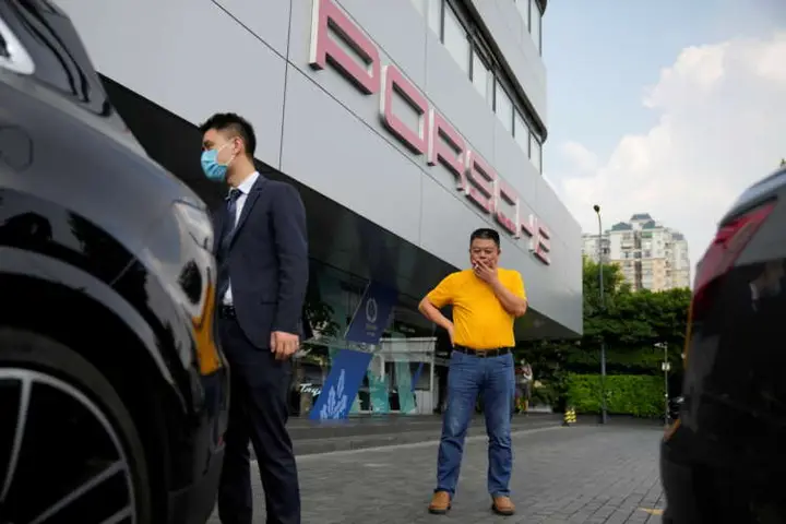 Image for Unpaid by Evergrande, supplier sells Porsche and home to rescue his business