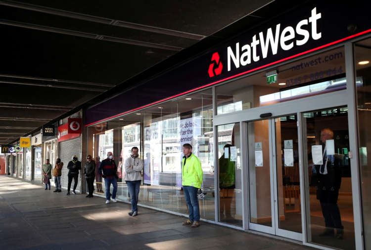 NatWest returns to profit after releasing cash for bad loans